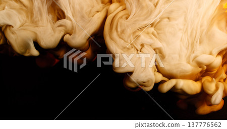 Abstract macro of milk mixing with coffee creating flowing creamy patterns and fluid shapes. Swirling liquid forms soft textures and organic motion, forming a dramatic beverage background. Abstract macro of milk mixing with coffee creating flowing creamy patterns and fluid shapes. Swirling liquid forms soft textures and organic motion, forming a dramatic beverage background. 137776562