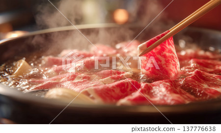 A scene of a shabu-shabu hot pot with thinly sliced beef. 137776638