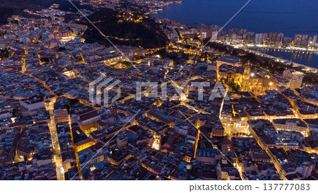Captivating Aerial Nightscape of Malaga, Spain Illuminated Streets and Coastal Beauty, travel, urban exploration and architecture stories. Captivating Aerial Nightscape of Malaga, Spain Illuminated Streets and Coastal Beauty, travel, urban exploration and architecture stories. 137777083