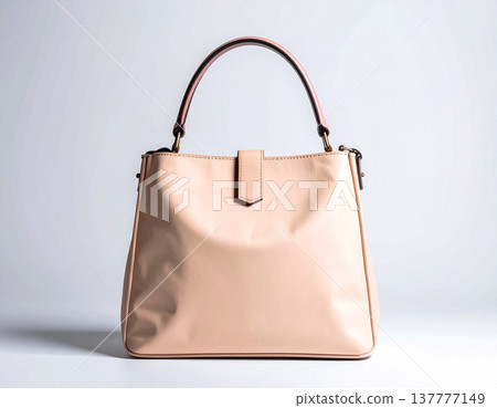 Lifestyle and fashion brands. Beige women's bag on a white background. Elegance and versatility. Minimalist fashion. 137777149