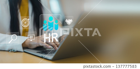 Human resources HR technology.Digital human resources management system.Smart recruitment and talent acquisition concept on laptop.Businesswoman hand typing on laptop with virtual HR interface. 137777583