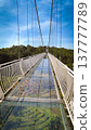 Glass suspension bridge floor with forest below and sky above Cau Kinh Da Lat Vietnam 137777789