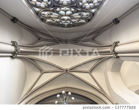 Interior details inside the church, lamps and stained-glass windows. Interior details inside the church, lamps and stained-glass windows. 137777888