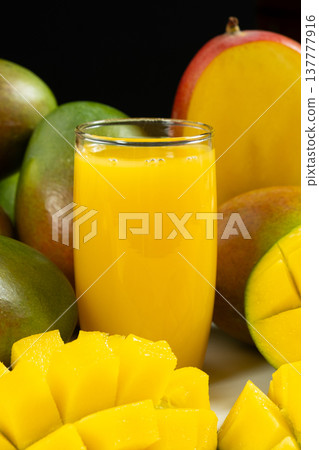 Natural vegan mango smoothie with tropical fruits. 137777916