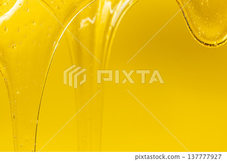 Abstract yellow background with viscous honey texture. Abstract yellow background with viscous honey texture. 137777927