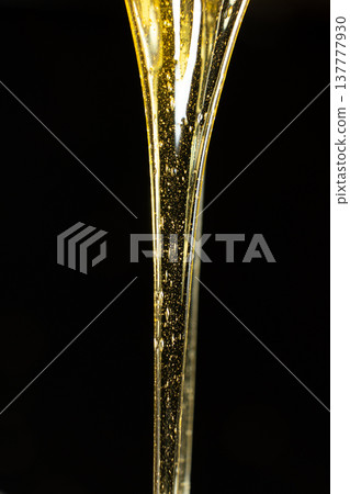 Luxury golden honey dripping on black background. 137777930