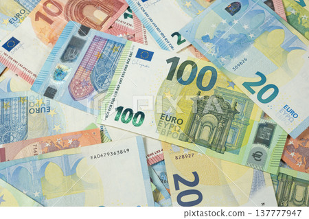 Pile of Euro banknotes of different denominations top view. Pile of Euro banknotes of different denominations top view. 137777947