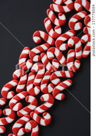 A lot of gingerbread candy cane shaped cookies, flat lay. A lot of gingerbread candy cane shaped cookies, flat lay. 137778084