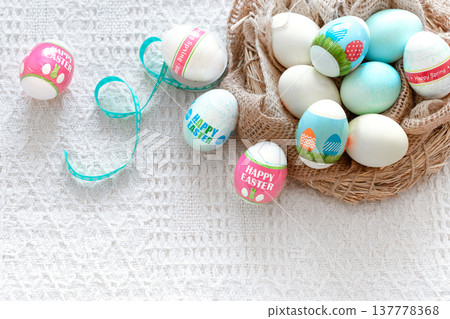 A nest of hay with beautiful Easter eggs A nest of hay with beautiful Easter eggs 137778368