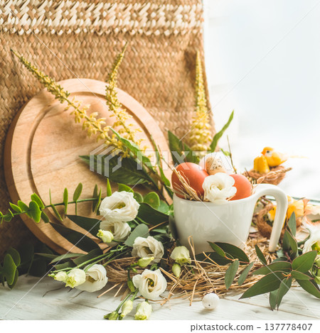 Happy Easter background. Easter egg in a nest with floral decoration near the window. Quail eggs. Happy Easter concept Happy Easter background. Easter egg in a nest with floral decoration near the window. Quail eggs. Happy Easter concept 137778407