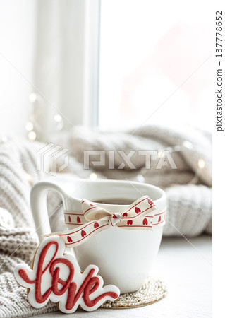Festive composition with a cup and decor details for Valentine's Day. 137778652