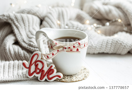 Festive composition with a cup and decor details for Valentine's Day. Festive composition with a cup and decor details for Valentine's Day. 137778657