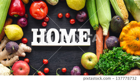Flat lay composition with decorative word home and vegetables. Flat lay composition with decorative word home and vegetables. 137778732