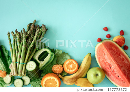 Fruits, berries and vegetables on a blue background. 137778872