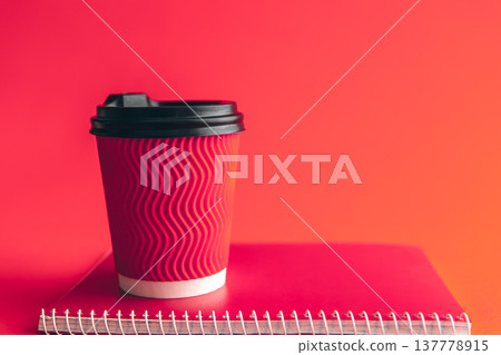 Glass and notepad in trendy Viva Magenta. 137778915