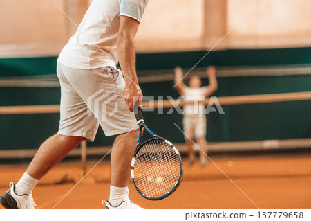 Particle view of man that is playing tennis 137779658