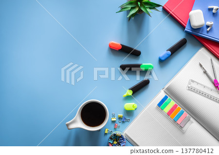 School supplies stationery on a blue background, copy space. School supplies stationery on a blue background, copy space. 137780412