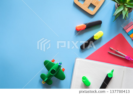 School supplies stationery on a blue background, copy space. School supplies stationery on a blue background, copy space. 137780413