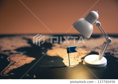Small flag and table lamp, travel concept. Small flag and table lamp, travel concept. 137780456