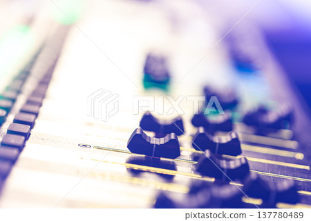 Close up, sound music mixer control panel on blurred background. Close up, sound music mixer control panel on blurred background. 137780489