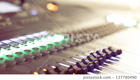 Close up, sound music mixer control panel on blurred background. Close up, sound music mixer control panel on blurred background. 137780490