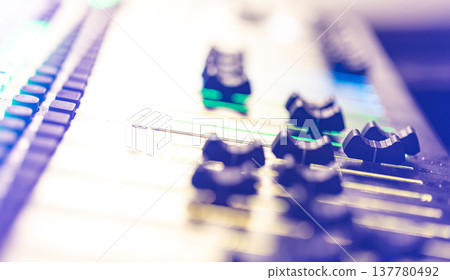 Close up, sound music mixer control panel on blurred background. Close up, sound music mixer control panel on blurred background. 137780492
