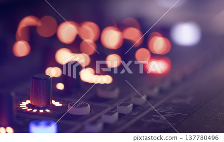 Close up, sound music mixer control panel on blurred background. Close up, sound music mixer control panel on blurred background. 137780496