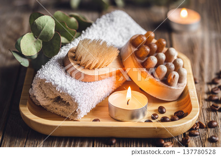 Spa composition with coffee massage scrub soap on a wooden surface. Spa composition with coffee massage scrub soap on a wooden surface. 137780528