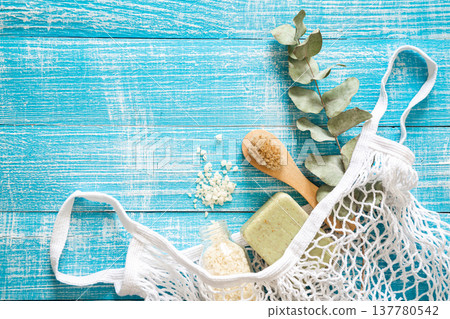 Spa composition with personal care items for body in a shopping bag, top view. 137780542