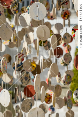 Decorative Art Installation with Painted Ceramic Discs Decorative Art Installation with Painted Ceramic Discs 137781309