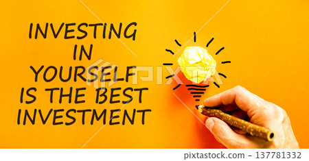 Investing in yourself symbol. Concept words Investing in yourself is the best investment on beautiful orange paper. Beautiful orange background. Business investing in yourself concept. Copy space 137781332