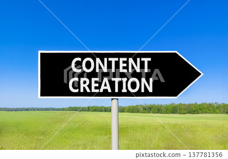 Time for content creation symbol. Concept words Content creation on beautiful black road sign. Beautiful blue sky green grass field background. Business time for content creation concept. Copy space. 137781356