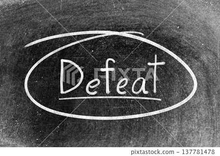 White chalk hand writing in word defeat and circle shape on blackboard background White chalk hand writing in word defeat and circle shape on blackboard background 137781478