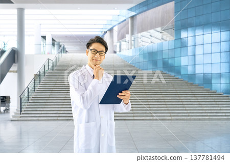 A lab coat specialist with a binder ideal for resolving questions and creating a Q&A section. 137781494