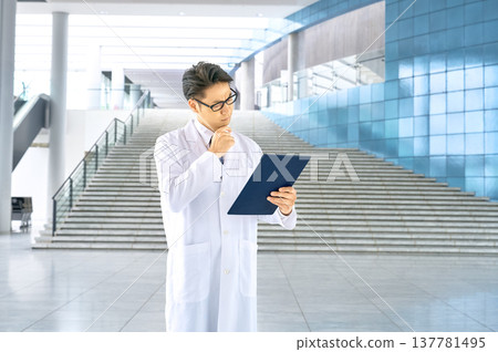 A before-and-after image of problem-solving! A white-coated specialist struggling with documents. 137781495