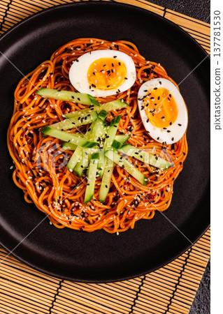 Korean traditional food, cucumber and boiled egg cold spicy noodles. 137781530