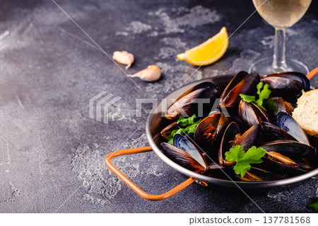 Delicious seafood mussels with sauce and parsley. Delicious seafood mussels with sauce and parsley. 137781568