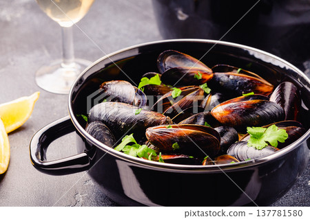 Delicious seafood mussels with sauce and parsley. Delicious seafood mussels with sauce and parsley. 137781580