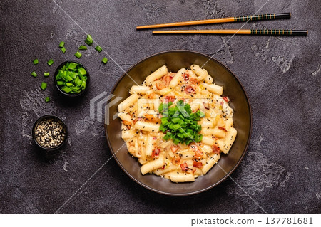 Spicy Rice Cake with Cheese and Bacon or Cream Teokbokki, Tteokbokki. Spicy Rice Cake with Cheese and Bacon or Cream Teokbokki, Tteokbokki. 137781681