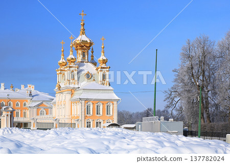 Russia, St. Petersburg, Peterhof, February 21, 2018. The photo shows the main court church in the Upper Park of the State Museum-Reserve "Peterhof" and people walking in the park and admiring the 137782024