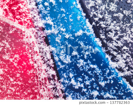 Abstract Winter Snow on Red and Blue Surface Detail Minimalist Geometry and Fresh Snowflakes Macro Photography in Budapest Hungary February Seasonal Texture Background without Accents Abstract Winter Snow on Red and Blue Surface Detail Minimalist Geometry and Fresh Snowflakes Macro Photography in Budapest Hungary February Seasonal Texture Background without Accents 137782363