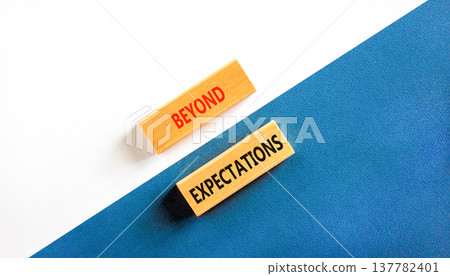 Beyond expectations words symbol. Concept words Beyond expectations on beautiful wooden blocks. Beautiful white and blue background. Business and Beyond expectations words concept. Copy space. Beyond expectations words symbol. Concept words Beyond expectations on beautiful wooden blocks. Beautiful white and blue background. Business and Beyond expectations words concept. Copy space. 137782401