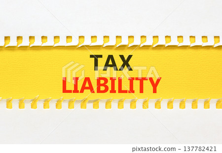 Tax liability words symbol. Concept words Tax liability on beautiful yellow paper. Beautiful white background. Business and Tax liability words concept. Copy space. Tax liability words symbol. Concept words Tax liability on beautiful yellow paper. Beautiful white background. Business and Tax liability words concept. Copy space. 137782421