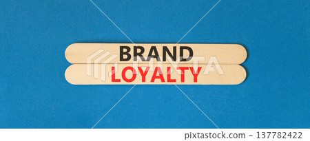 Brand loyalty words symbol. Concept words Brand loyalty on beautiful wooden sticks. Beautiful blue background. Business and Brand loyalty words concept. Copy space. Brand loyalty words symbol. Concept words Brand loyalty on beautiful wooden sticks. Beautiful blue background. Business and Brand loyalty words concept. Copy space. 137782422