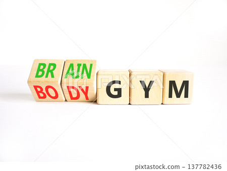 Body vs brain gym symbol. Concept words Body gym to Brain gym on beautiful wooden cubes. Beautiful white table white background. Business healthy lifestyle and body vs brain gym concept. Copy space. 137782436