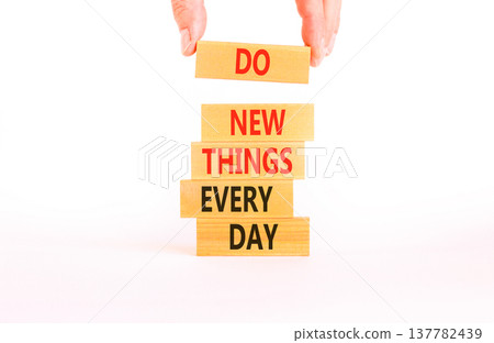 Do new things every day words symbol. Concept words Do new things every day on beautiful wooden blocks. Beautiful white paper background. Business do new things every day concept. Copy space. 137782439