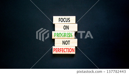 Progress or perfection words symbol. Concept words Focus on progress not perfection on beautiful wooden blocks. Beautiful black paper background. Business progress or perfection concept. Copy space. 137782443