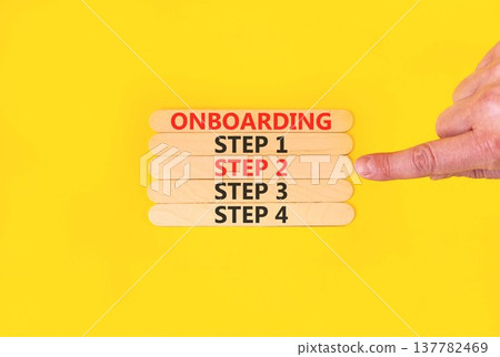 Time to step 2 onboarding symbol. Concept words Onboarding step 2 on beautiful wooden block. Businessman's hand. Beautiful yellow background. Business success step 2 onboarding concept. Copy space. Time to step 2 onboarding symbol. Concept words Onboarding step 2 on beautiful wooden block. Businessman's hand. Beautiful yellow background. Business success step 2 onboarding concept. Copy space. 137782469
