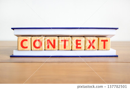 Context symbol. Concept word Context on beautiful wooden blocks in book. Beautiful wooden table white background. Business context concept. Copy space. Context symbol. Concept word Context on beautiful wooden blocks in book. Beautiful wooden table white background. Business context concept. Copy space. 137782501