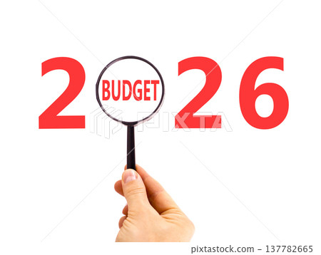 2026 budget symbol. Concept words 2026 budget in beautiful magnifying glass. Beautiful white background. Businessman's hand. Business 2026 budget concept. Copy space. 2026 budget symbol. Concept words 2026 budget in beautiful magnifying glass. Beautiful white background. Businessman's hand. Business 2026 budget concept. Copy space. 137782665